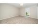 Neutral bedroom featuring carpet and natural light from a window at 401 Wyndham Drive, Fuquay Varina, NC 27526