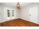 Cozy dining area with hardwood floors, natural light, and access to the backyard at 401 Wyndham Drive, Fuquay Varina, NC 27526