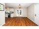 Open concept dining area with hardwood floors and convenient access to the kitchen at 401 Wyndham Drive, Fuquay Varina, NC 27526