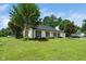 Well-maintained home featuring lush lawn, dark shutters, and classic architectural details at 401 Wyndham Drive, Fuquay Varina, NC 27526