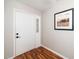 Bright entry foyer featuring hardwood floors and a decorative door with glass accents at 401 Wyndham Drive, Fuquay Varina, NC 27526