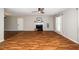 Bright living room with hardwood floors, fireplace, and large windows at 401 Wyndham Drive, Fuquay Varina, NC 27526