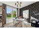 Stylish home office with bright windows, contemporary desk, and chic black and white patterned wallpaper at 404 Gaston Park Ln # 200, Wake Forest, NC 27587