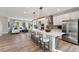 Bright kitchen with white cabinets, stainless steel appliances, and a large island with seating at 404 Gaston Park Ln # 200, Wake Forest, NC 27587