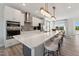 Contemporary kitchen with a spacious island, white countertops, and stainless steel appliances at 404 Gaston Park Ln # 200, Wake Forest, NC 27587