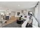 Open concept living area with modern decor, wood-look flooring, and comfortable seating at 410 Gaston Park Ln # 200, Wake Forest, NC 27587