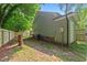 Backyard with a wooden fence and an air conditioning unit at 413 Top Greene Ln, Raleigh, NC 27601