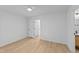 Spacious bedroom with hardwood floors, ceiling fan, and two closets at 413 Top Greene Ln, Raleigh, NC 27601