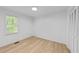 Bright bedroom with hardwood floors and a large closet at 413 Top Greene Ln, Raleigh, NC 27601