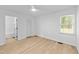 Spacious bedroom with hardwood floors, ceiling fan, and closet at 413 Top Greene Ln, Raleigh, NC 27601
