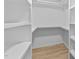 Walk in closet with shelving and hardwood floor at 413 Top Greene Ln, Raleigh, NC 27601