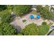Aerial view of a community playground with slides, swings, and play structures, surrounded by trees at 413 Top Greene Ln, Raleigh, NC 27601