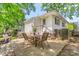 Backyard with a stone patio, table and chairs, and a view of the well-maintained lawn at 422 Hyde St, Burlington, NC 27217