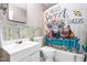 Bathroom featuring a unique shower curtain, vanity sink, and mirror at 422 Hyde St, Burlington, NC 27217