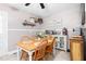 Cozy dining area with neutral walls, wood table and chairs, and decorative shelving at 422 Hyde St, Burlington, NC 27217
