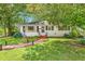 Charming single-story home featuring a brick walkway and well-maintained landscaping at 422 Hyde St, Burlington, NC 27217