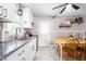 Bright kitchen with white cabinets, stainless steel sink, and cozy dining area at 422 Hyde St, Burlington, NC 27217