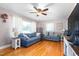 Bright living room with hardwood floors and comfortable seating at 422 Hyde St, Burlington, NC 27217