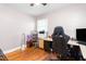 Home office featuring a black computer chair, hardwood floors, and natural light at 422 Hyde St, Burlington, NC 27217