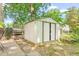 Exterior shot of backyard storage shed on a landscaped lot at 422 Hyde St, Burlington, NC 27217