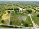 Aerial view showing property lines, pond, and vast acreage of wooded land at 4659 Antioch Rd, Oxford, NC 27565