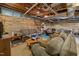 Finished basement featuring wood paneling, exposed ductwork, and comfortable seating area at 4659 Antioch Rd, Oxford, NC 27565