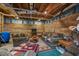 Basement featuring wood paneling, exposed ductwork, and comfortable seating area at 4659 Antioch Rd, Oxford, NC 27565