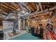 Basement featuring exposed ceiling, wood accents, and cozy seating area with exercise equipment at 4659 Antioch Rd, Oxford, NC 27565