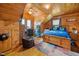 Wood paneled bedroom, complete with desk space, ceiling fan, and a vibrant and comfortable setting at 4659 Antioch Rd, Oxford, NC 27565