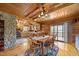 Inviting dining room with wood accents, ceiling fan, and view of the open kitchen at 4659 Antioch Rd, Oxford, NC 27565