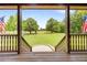 View of the grounds from the porch through the entryway at 4659 Antioch Rd, Oxford, NC 27565
