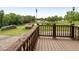 View from the wooden porch of the outbuildings, sheds, and pond at 4659 Antioch Rd, Oxford, NC 27565