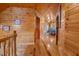 Wood-paneled hallway featuring wood floors and decor; doorway leading to a room with natural light at 4659 Antioch Rd, Oxford, NC 27565