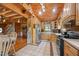 Charming kitchen with wooden cabinets, stone accents, and modern appliances at 4659 Antioch Rd, Oxford, NC 27565