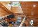 Cozy living room with wood paneling, fireplace, TV and comfortable seating, viewed from above at 4659 Antioch Rd, Oxford, NC 27565