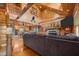 Spacious living room with vaulted wood ceilings, stone fireplace, and open kitchen concept at 4659 Antioch Rd, Oxford, NC 27565