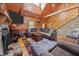 Cozy living room featuring stone fireplace, wood accents, and comfortable seating at 4659 Antioch Rd, Oxford, NC 27565