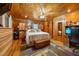 Bright main bedroom featuring wood paneling, decor, and natural light from a window at 4659 Antioch Rd, Oxford, NC 27565