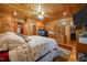 Bright main bedroom with wood paneling, en-suite with workstation, and decorative furnishings at 4659 Antioch Rd, Oxford, NC 27565