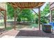 View of the back patio with mulch and wooded area at 4933 Wyatt Brook Way, Raleigh, NC 27609