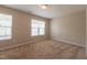 A view of a vacant bedroom with 2 windows at 4933 Wyatt Brook Way, Raleigh, NC 27609