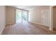 A bedroom with sliding glass doors that lead to a small patio at 4933 Wyatt Brook Way, Raleigh, NC 27609