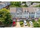 A bird's eye view of townhomes with brick foundations, garages, and diverse architectural details at 4933 Wyatt Brook Way, Raleigh, NC 27609