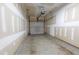 Spacious two-car garage with concrete floor, drywall, and overhead door at 4933 Wyatt Brook Way, Raleigh, NC 27609