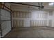 A view of the inside of an empty one car garage at 4933 Wyatt Brook Way, Raleigh, NC 27609