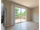 Bright kitchen area features a sliding glass door leading to a backyard deck surrounded by lush greenery at 4933 Wyatt Brook Way, Raleigh, NC 27609