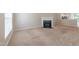 Large living room featuring plush carpeting, a fireplace, and natural light at 4933 Wyatt Brook Way, Raleigh, NC 27609