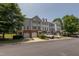 Exterior of townhomes with garages and parking at 4933 Wyatt Brook Way, Raleigh, NC 27609