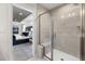 Bathroom showcases tiled shower with a glass enclosure and a bench seat visible from an open doorway to the main bedroom at 512 Providence Springs Ln, Fuquay Varina, NC 27526