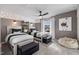 Bright bedroom with two twin beds, soft carpeting, a ceiling fan, natural light from the window and creative wall decor at 512 Providence Springs Ln, Fuquay Varina, NC 27526